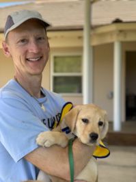 Keysight Chief Technology Officer, Jay Alexander, volunteering at Canine Companions for Independence, an organization that provides assistance dogs free of charge to enhance the lives of people with disabilities.